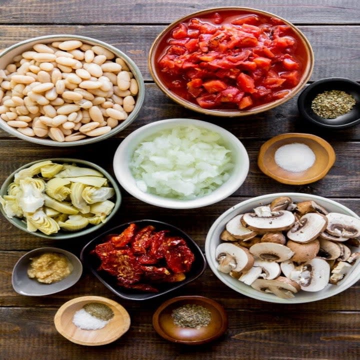 Ingredients for white bean skillet in mixing bowls