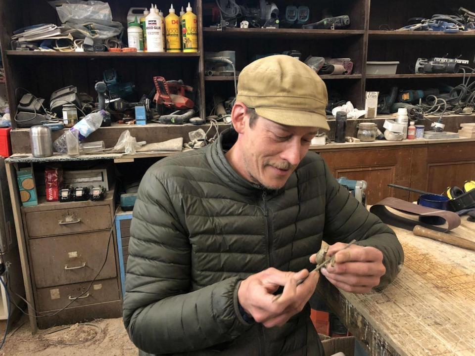 Simon Harlow in the Govanhill workshop he shares with Simon Richardson, with a figurine he made for Lucy Skaer (Lindsey Johnstone)