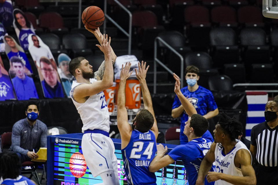 Seton Hall's Sandro Mamukelashvili (23) shoots over Creighton's Mitch Ballock (24) during the first half of an NCAA college basketball game Wednesday, Jan. 27, 2021, in Newark, N.J. (AP Photo/Frank Franklin II)