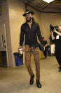 DeMarre Carroll wears a gold lined black hat with a lace shirt and cheetah print trousers ahead of the Nets, Sixers game on April 13.
