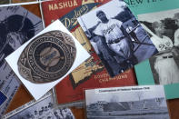 A selection of Nashua Dodgers memorabilia is displayed at City Hall, Tuesday, May 23, 2023, in Nashua, N.H. Holman Stadium in Nashua is being recognized for hosting the country's first racially integrated baseball team, the Nashua Dodgers, in 1946. The club was a minor league league affiliate of the Brooklyn Dodgers, which included Hall of Famer Roy Campanella and future Cy Young Award winner Don Newcombe. (AP Photo/Charles Krupa)