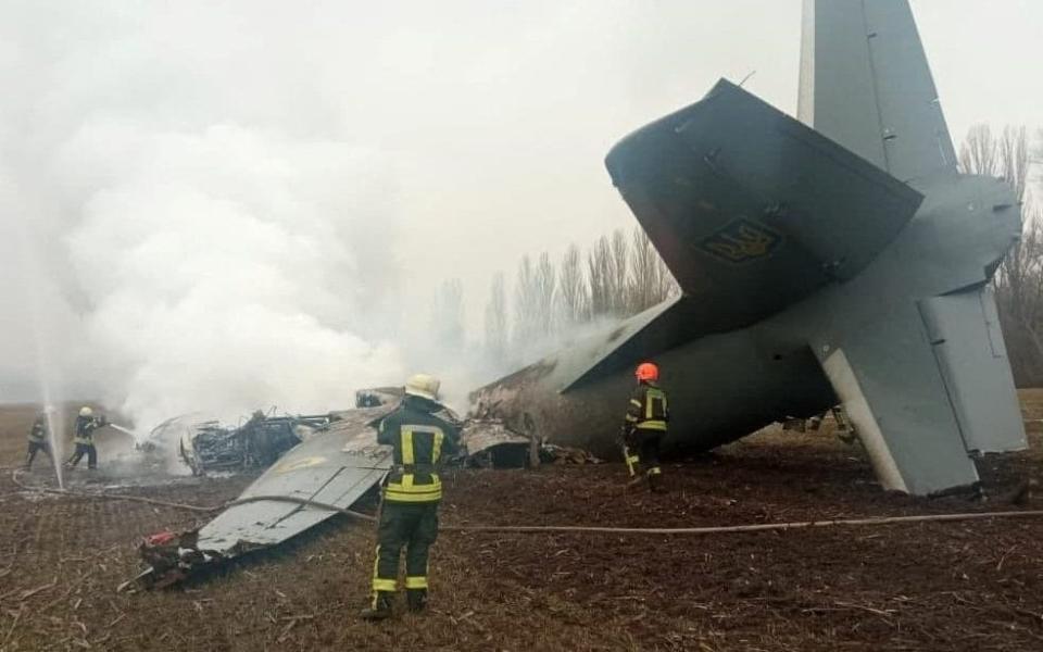 Rescuers work at the crash site of the Ukrainian Armed Forces' Antonov aircraft, which, according to the State Emergency Service, was shot down in Kyiv region, Ukraine - REUTERS