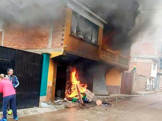 Image released by Boliva’s Presidency showing the house of Bolivia’s Ministry of Mining and Metallurgy, Cesar Navarro, burning after protesters set it on fire demanding his resignation on 10 November, 2019. (Bolivian Presidency/AFP via Getty)