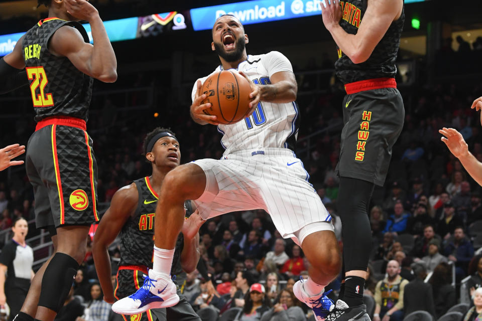 Orlando Magic guard Evan Fournier goes up to shoot against the Atlanta Hawks during the first half of an NBA basketball game Wednesday, Feb. 26, 2020, in Atlanta. (AP Photo/John Amis)