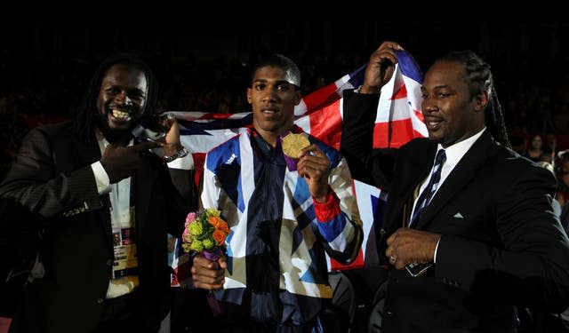 Anthony Joshua (centre) celebrates