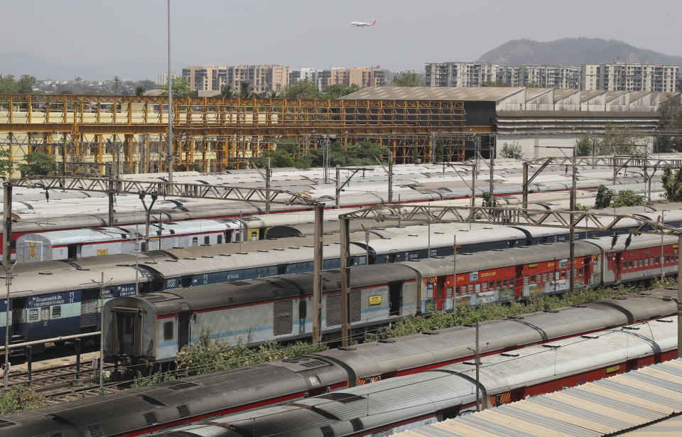 Trains are parked at Lokmanya Tilak Terminus in Mumbai, India, Monday, March 23, 2020. Authorities have gradually started to shutdown much of the country of 1.3 billion people to contain the outbreak. For most people, the new coronavirus causes only mild or moderate symptoms. For some it can cause more severe illness. (AP Photo/Rafiq Maqbool)