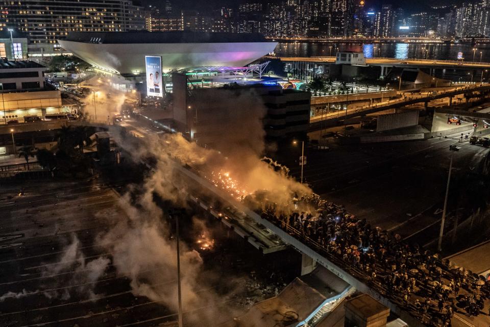 Protesters and police clash as on a bridge at The Hong Kong Poytechnic University on Nov. 17, 2019 in Hong Kong, China. (Photo: Anthony Kwan/Getty Images)