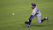 Los Angeles Dodgers right fielder Mookie Betts (50) catches a fly ball from Atlanta Braves shortstop Dansby Swanson then throws to home in the third inning of Game 5 of a baseball National League Championship Series, Friday, Oct. 16, 2020, in Arlington, Texas. (Curtis Compton/Atlanta Journal-Constitution via AP)