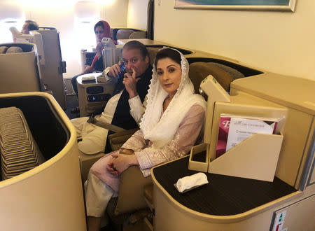 Ousted Pakistani Prime Minister Nawaz Sharif and his daughter Maryam sit on a Lahore-bound flight due for departure, at Abu Dhabi International Airport, UAE July 13, 2018. REUTERS/ Drazen Jorgic