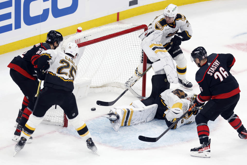 Carolina Hurricanes' Jesperi Kotkaniemi (82) scores on Boston Bruins' Linus Ullmark (35) during the first period of an NHL hockey game, Friday, Nov. 25, 2022, in Boston. (AP Photo/Michael Dwyer)