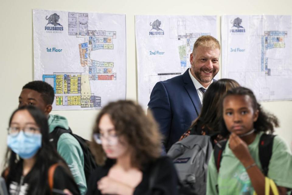 Principal Erik Olejarczyk helps students find their classrooms during the first day of school at Palisades High School. Students have clear opinions about what they want in a new superintendent.