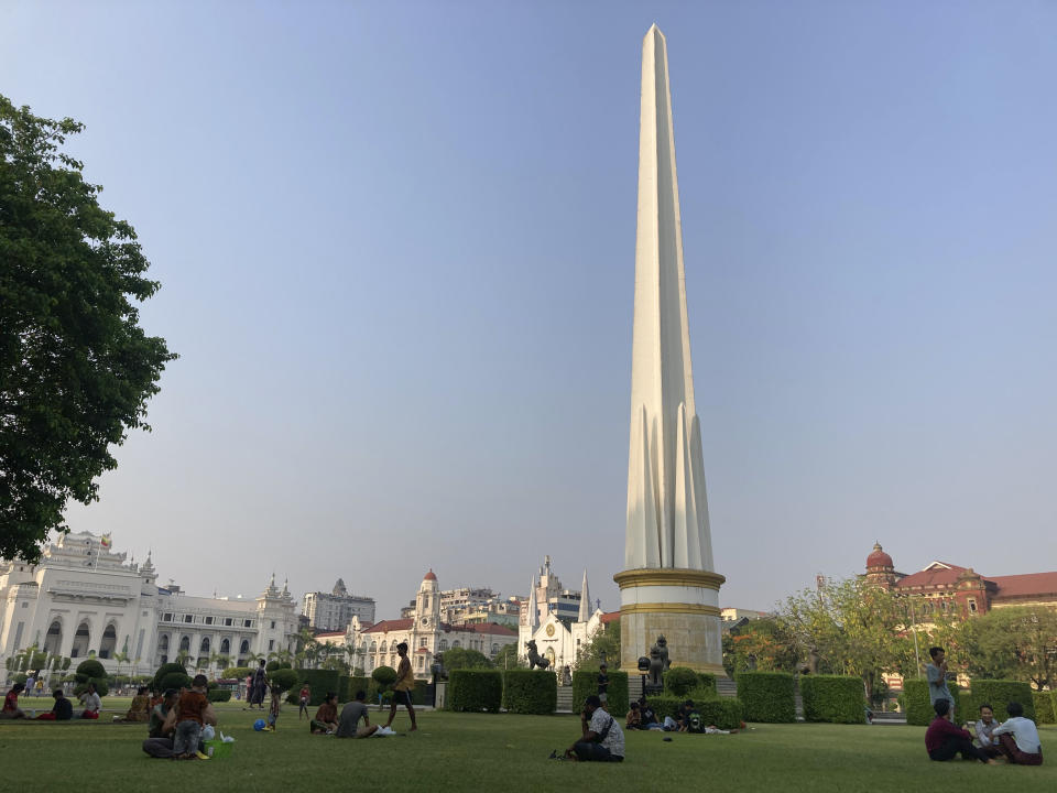 People take rest a park near city hall and high court in Yangon, Myanmar, Monday, April 29, 2024. (AP Photo)