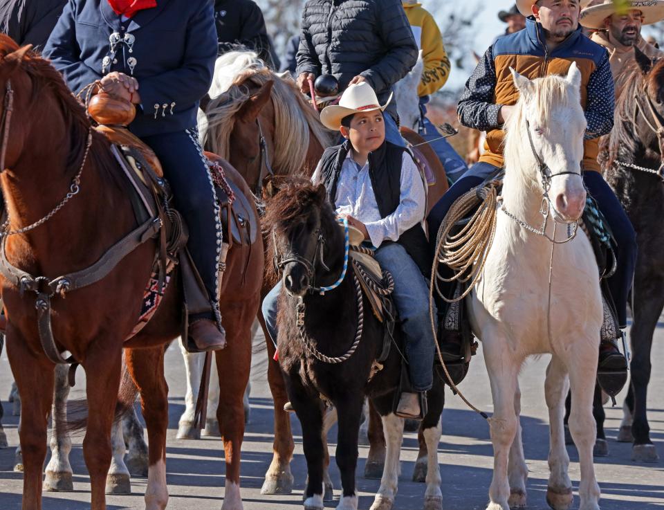 Horses and riders participate in a processional for the feast day of St. Juan Diego as it ends at Tepeyac Hill at the Blessed Stanley Rother Rother Shrine on Saturday in Oklahoma City. Mandatory Credit: Steve Sisney-The Oklahoman
(Credit: Steve Sisney for The Oklahoman)