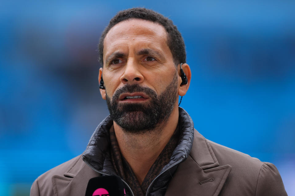 Rio Ferdinand wears brown coat