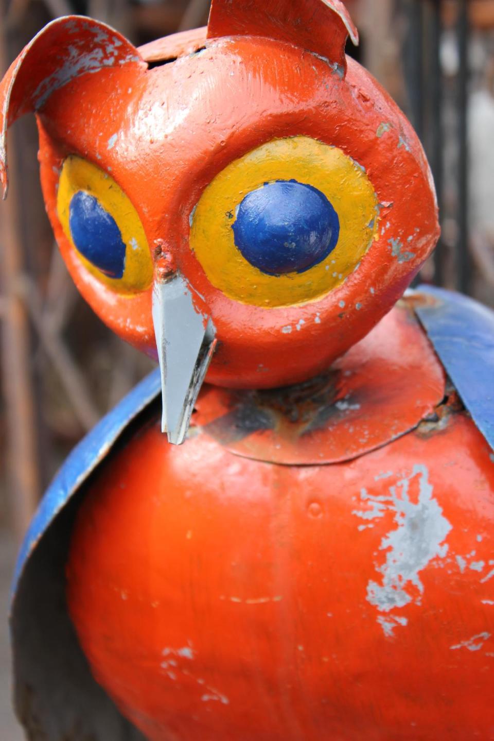 In this Saturday, May 19, 2012 photo, a whimsical owl sculpture is diplayed at Home & Garden Art in Seattle. The sculpture is made in the Southern U.S. from recycled oil drums, primarily salvaged in Texas. (AP Photo/Cedar Burnett)
