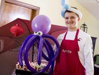 Barton Christmas making balloon art as a young boy