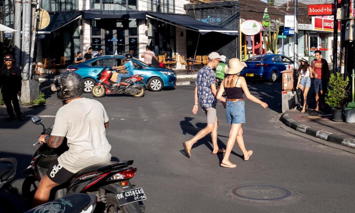 <span>Tourists in Seminyak, Bali, Indonesia. A moratorium on new hotels has been implemented at the popular tourist destination.</span><span>Photograph: Made Nagi/EPA</span>