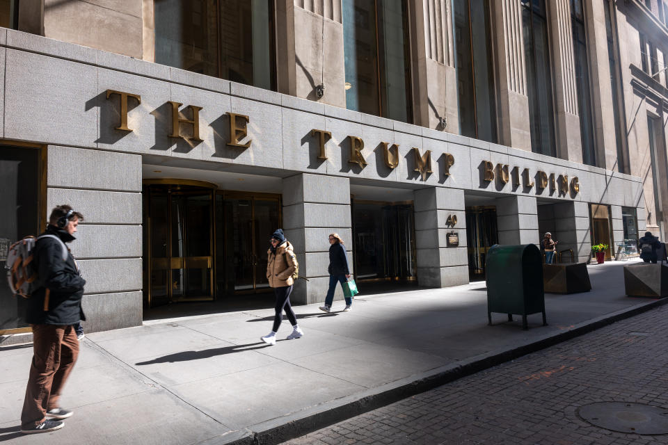 NEW YORK, NEW YORK - MARCH 19: People walk by 40 Wall Street, a Trump-owned building in downtown Manhattan on March 19, 2024 in New York City. Former U.S. President Donald Trump has reportedly been unable to secure a bond to appeal the $454 million penalty in his civil fraud case, with New York Attorney General Letitia James stating that she is prepared to seize the former president's assets, including the building at 40 Wall Street, if he is unable to pay. Trump was fined $354.8 million plus approximately $100 million in pre-judgment interest after Judge Arthur Engoron determined that he inflated his net worth in order to receive more favorable loan terms.  (Photo by Spencer Platt/Getty Images)