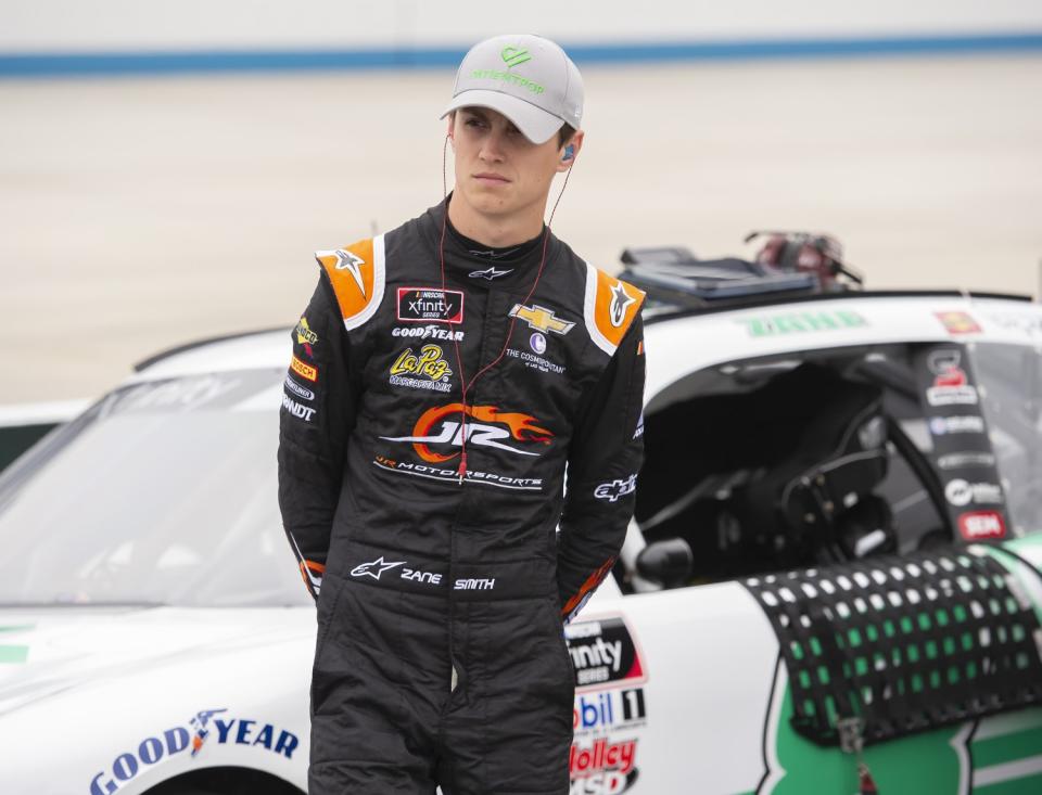 Zane Smith stands by his car during NASCAR Xfinity series qualifying on May 4, 2019, at Dover International Speedway.