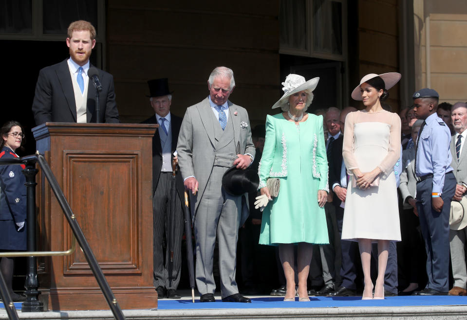 Prince Harry, Duke of Sussex gives a speech next to Prince Charles, Prince of Wales, Camilla, Duchess of Cornwall and Meghan, Duchess of Sussex as they attend The Prince of Wales' 70th Birthday Patronage Celebration held at Buckingham Palace on May 22, 2018 in London, England.