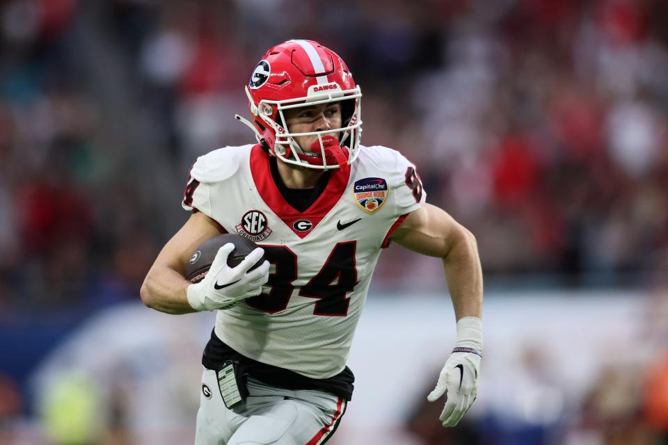 Dec 30, 2023; Miami Gardens, FL, USA; Georgia Bulldogs wide receiver Ladd McConkey (84) makes a catch and runs for touchdown against the Florida State Seminoles during the first half in the 2023 Orange Bowl at Hard Rock Stadium. Mandatory Credit: Sam Navarro-USA TODAY Sports