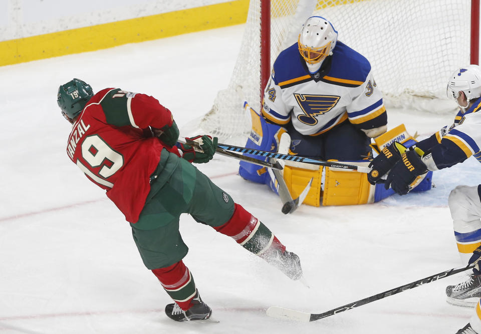 FILE - In this March 7, 2017, file photo, St. Louis Blues goalie Jake Allen stops a shot by Minnesota Wild's Martin Hanzal during the third period of an NHL hockey game Tuesday, March 7, 2017, in St. Paul, Minn. Here comes Minnesota's first-round opponent, none other than the surging St. Louis team coached by former Wild bench boss Mike Yeo. The Blues were ousted in the Western Conference quarterfinals by the Wild two years ago. (AP Photo/Jim Mone, File)