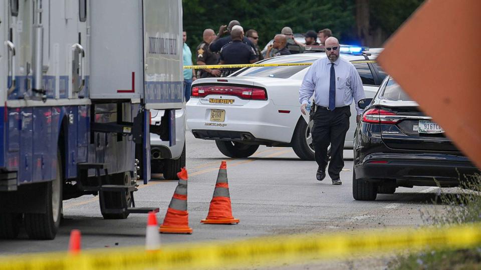PHOTO: Officers and detectives gather at the scene where a suspect crashed a jail wagon after stealing it, July 10, 2023, just outside the Community Justice Campus in Indianapolis. (Indianapolis Star via USA Today Network)