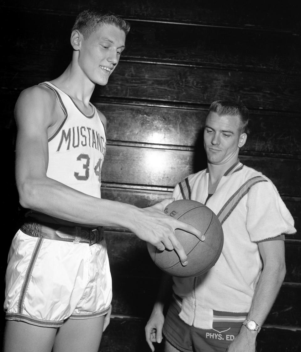 David Lipscomb High 6-8 center Clyde Lee, left, shares a moment with his head coach Damon Daniel, who also doubles as school principal, during a photo shoot at the school Nov. 8, 1961.