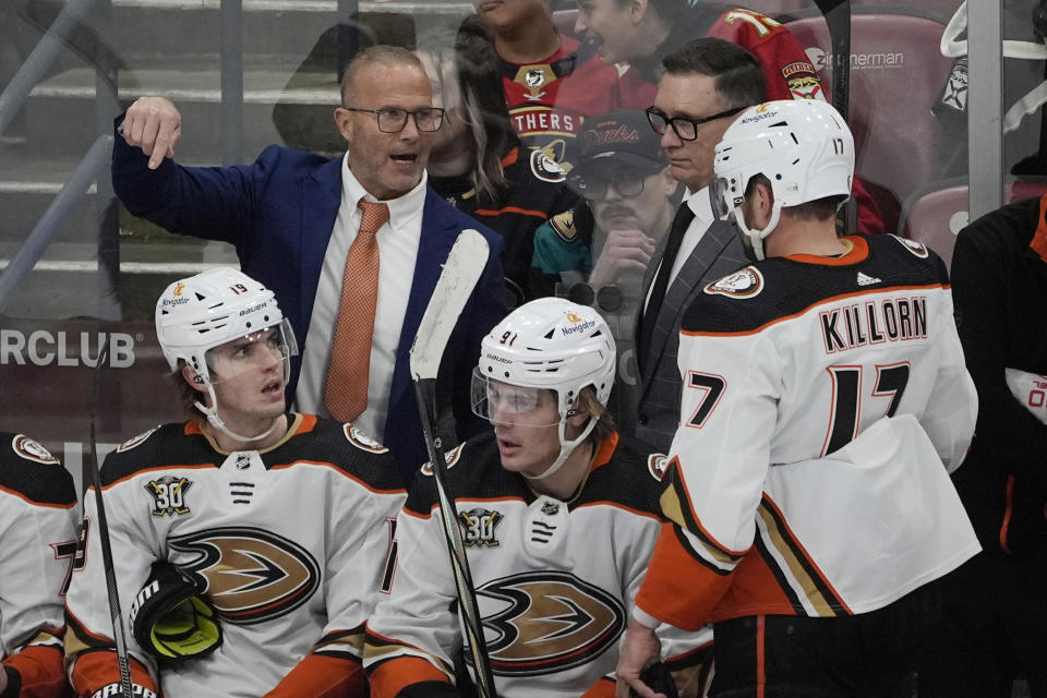 Anaheim Ducks head coach Greg Cronin talks to left wing Alex Killorn (17) during the first period of an NHL hockey game against the Florida Panthers, Monday, Jan. 15, 2024, in Sunrise, Fla. (AP Photo/Marta Lavandier)