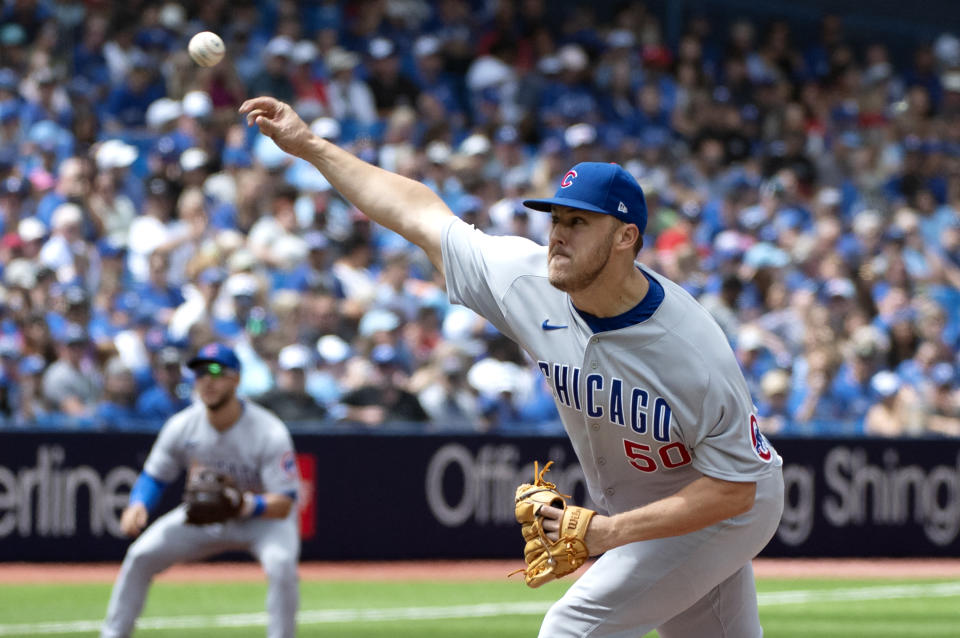 Chicago Cubs starting pitcher Jameson Taillon (50) throws to a Toronto Blue Jays batter in first-inning baseball game action in Toronto, Sunday, Aug. 13, 2023. (Jon Blacker/The Canadian Press via AP)