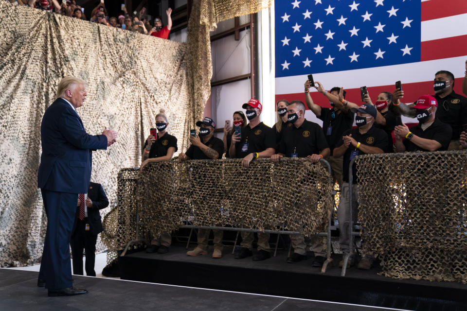 President Donald Trump arrives to speak to a crowd of supporters at Yuma International Airport, Tuesday, Aug. 18, 2020, in Yuma, Ariz. (AP Photo/Evan Vucci)