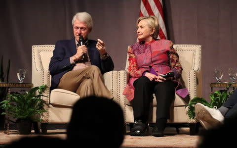 Bill Clinton with his wife, Hillary Clinton - Credit: AP