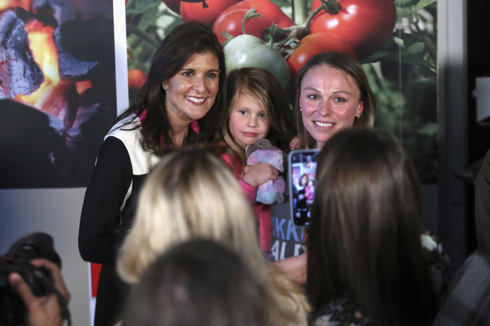 Republican presidential candidate former UN Ambassador Nikki Haley, left, takes a photo with supporters after speaking at a campaign event on Thursday, Feb. 1, 2024, in Columbia, S.C. (AP Photo/Artie Walker Jr.)