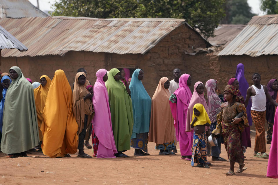 FILE - Parents wait for news about the kidnapped LEA Primary and Secondary School Kuriga students in Kuriga, Kaduna, Nigeria, on March 9, 2024. Nearly 300 schoolchildren abducted from their school in northwest Nigeria’s Kaduna state have been released, the state governor said Sunday, March 24, more than two weeks after the children were seized from their school. (AP Photo/Sunday Alamba, File)