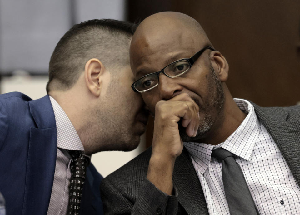 FILE - Christopher Dunn, right, listens to his attorney Justin Bonus from New York City during the first day of his hearing to decide whether to vacate his murder conviction, Tuesday, May 21, 2024, at the Carnahan Courthouse in St. Louis. A Missouri judge on Monday, July 24, 2024, overturned the conviction of Dunn, who has spent more than 30 years in prison for a killing he has long contended he didn’t commit. (Laurie Skrivan/St. Louis Post-Dispatch via AP, Pool, File)