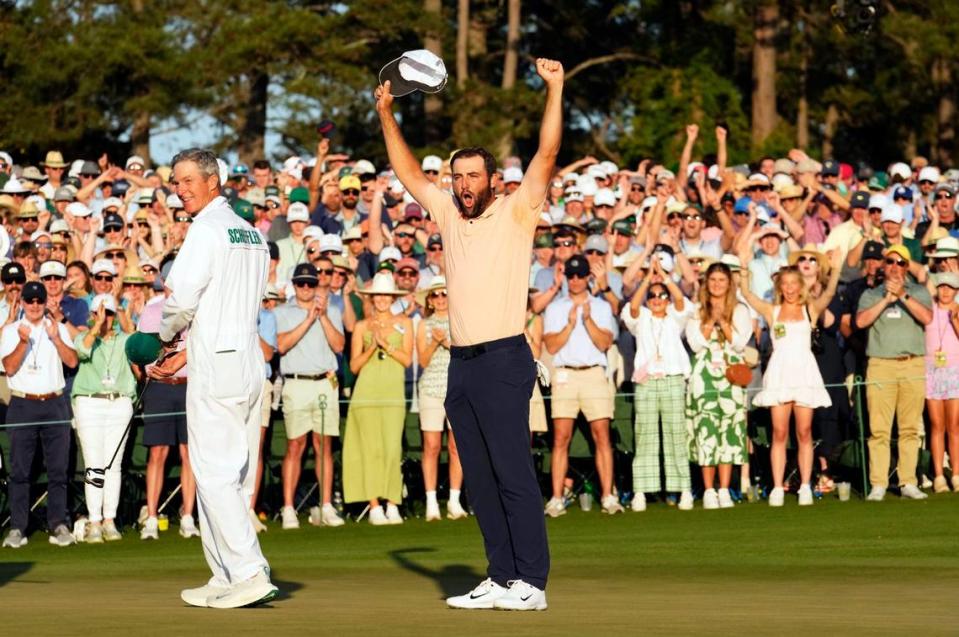 Scottie Scheffler celebrates on the 18th green after winning the 2024 Masters.