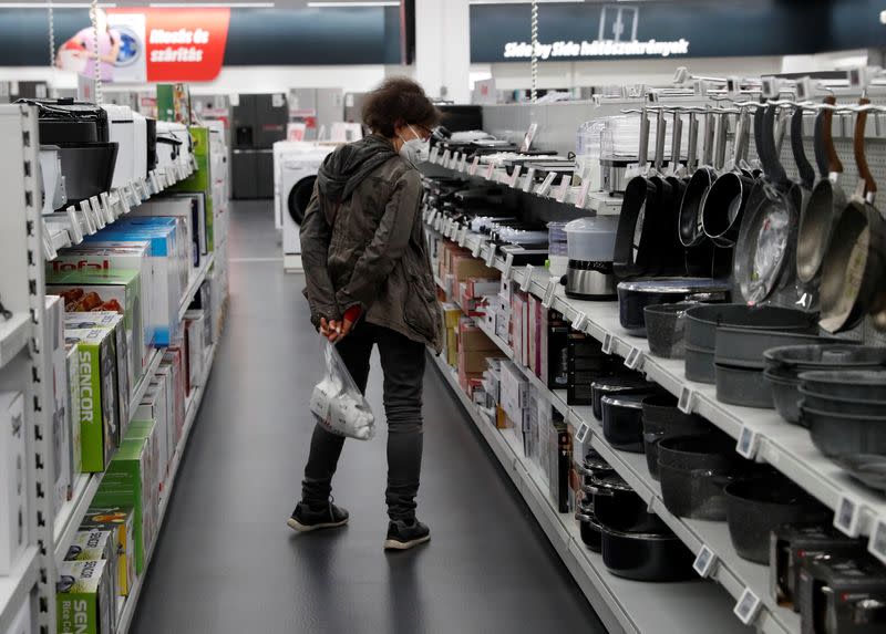 FILE PHOTO: A woman shops at consumer electronics retailer Media Markt in Budapest