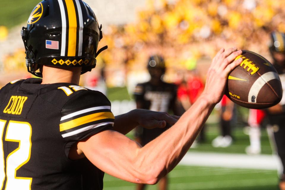 Missouri quarterback Brady Cook winds up to throw a pass during warm-ups before MU's 35-10 win over South Dakota at Memorial Stadium on August 31, 2023, in Columbia, Mo.