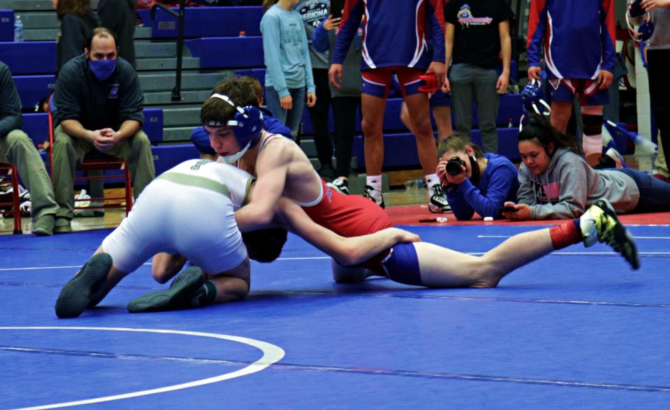 Jay County's Cody Rowles (right) wrestles Norwell's Cayden Smithley in the 106-pound regional championship at Jay County High School Saturday, Feb. 6, 2021.