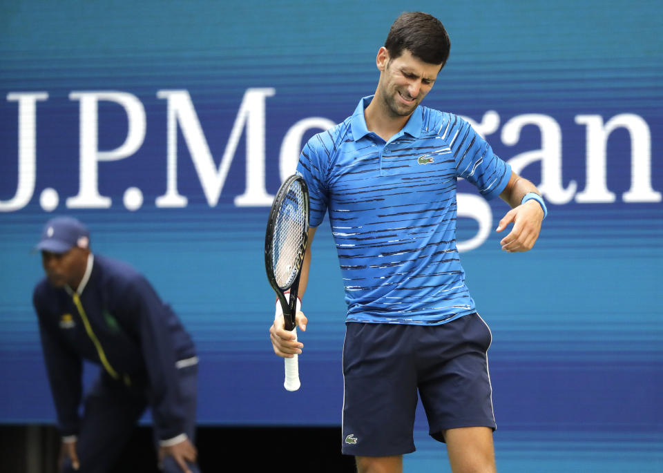 Novak Djokovic, of Serbia, reacts after a shot to Roberto Carballes Baena, of Spain, during the first round of the US Open tennis tournament Monday, Aug. 26, 2019, in New York. (AP Photo/Frank Franklin II)