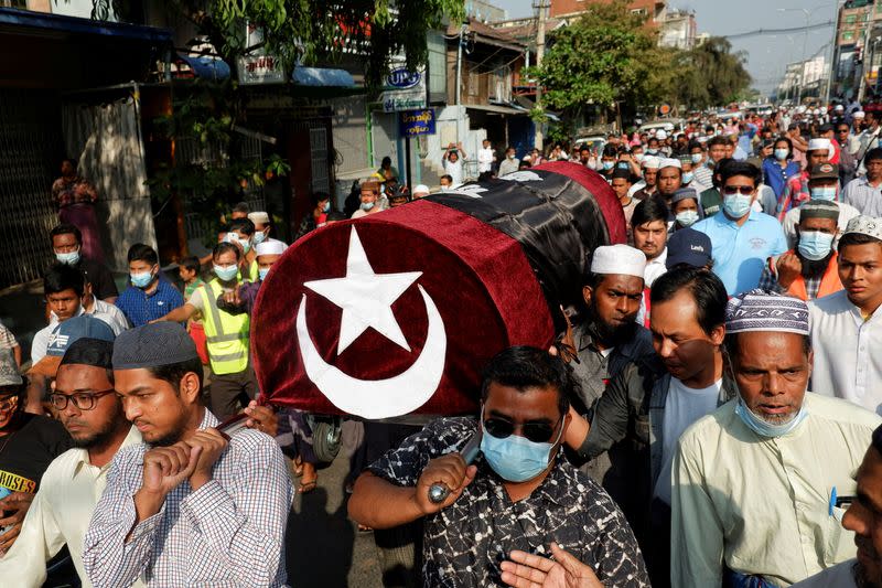 People attend the funeral of a woman who was shot dead during an anti-coup demonstration in Mandalay