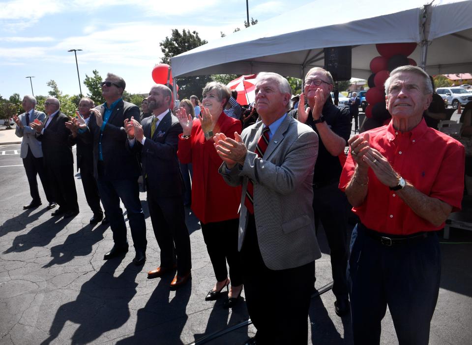 Dignitaries applaud as a tarp is lifted and the name revealed for the Julia Jones Matthews School of Population and Public Health on Wednesday. The facility is part of Abilene's Texas Tech University Health Sciences Center.