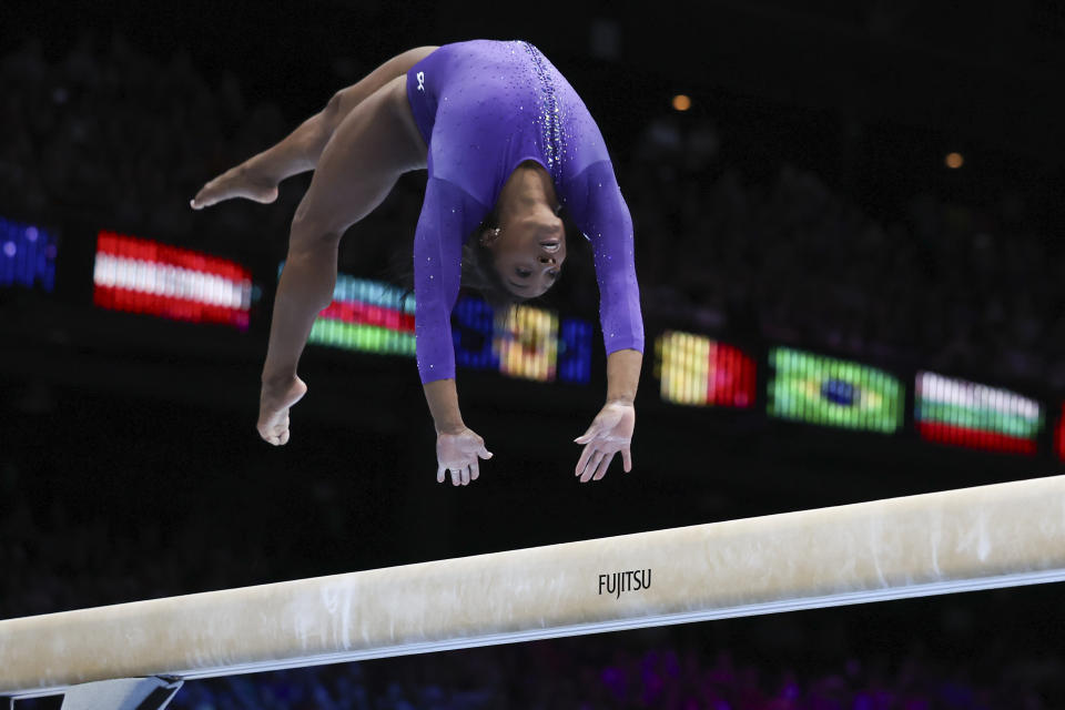 United States' Simone Biles competes on the beam during the apparatus finals at the Artistic Gymnastics World Championships in Antwerp, Belgium, Sunday, Oct. 8, 2023. (AP Photo/Geert vanden Wijngaert)