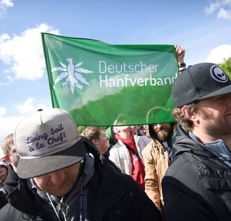 People celebrate at the rally and festival for the legalization of cannabis at the Brandenburg Gate. Paul Zinken/dpa