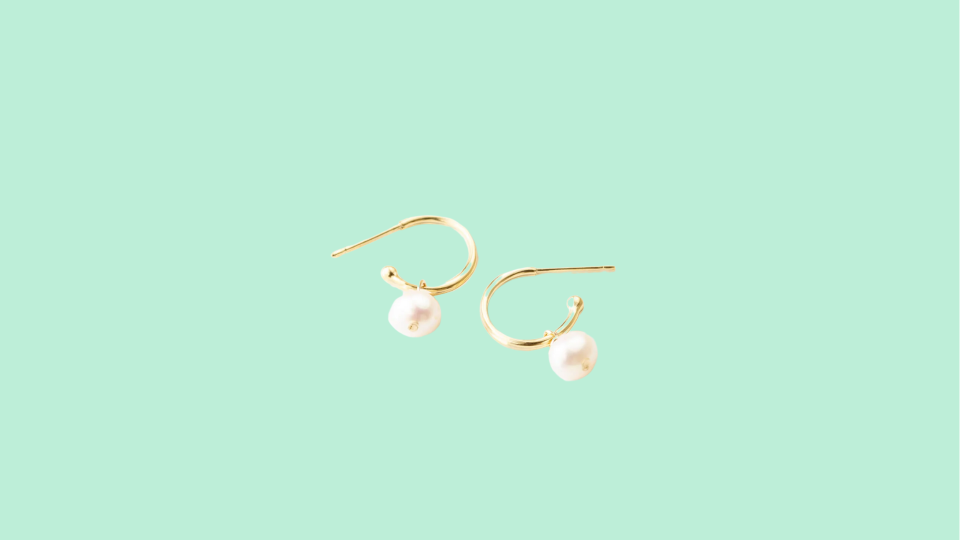 Shop the best jewelry gifts this Christmas at GLDN: Sia Pearl Huggie Hoops