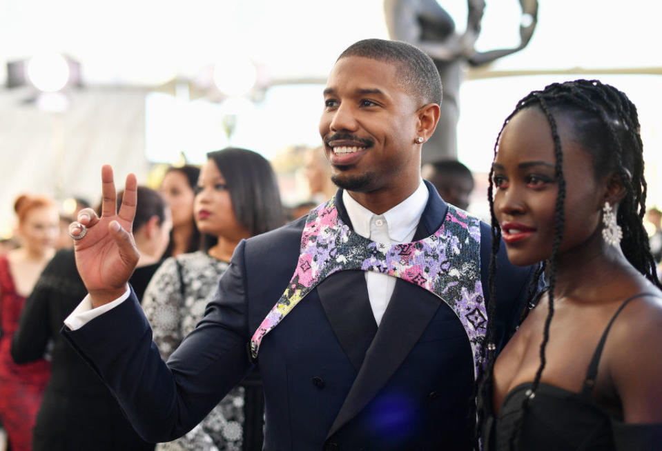 the actors on a red carpet together