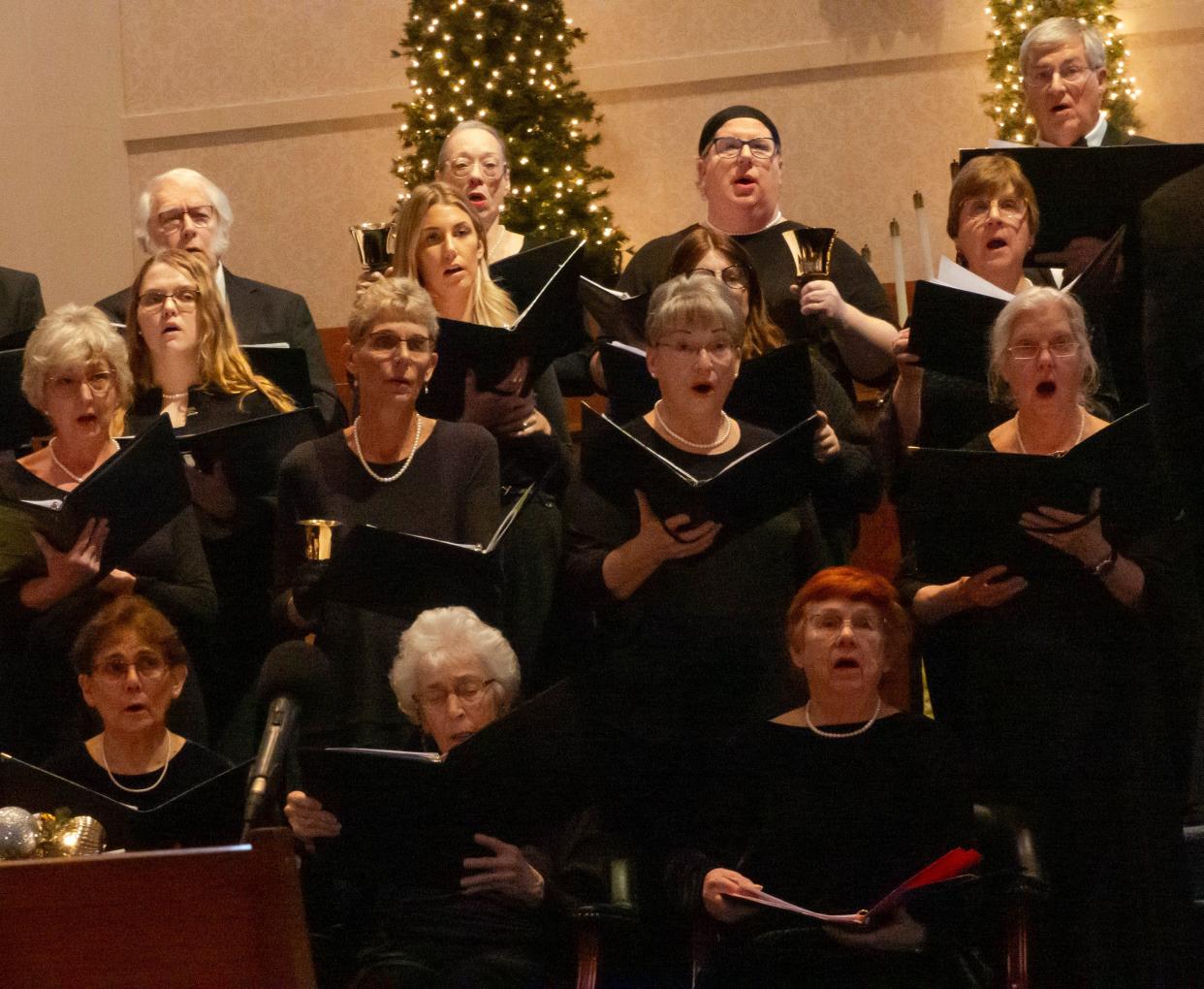 Soprano and tenor ensemble members of the Lenawee Community Chorus are pictured singing during the community chorus' holiday concert held Dec. 17, 2023, at Adrian College's Herrick Chapel.