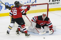 New Jersey Devils goaltender Mackenzie Blackwood (29) makes a save with New Jersey Devils defenseman P.K. Subban (76) fending off Penguins right wing Bryan Rust (17in front of the crease during the second period of an NHL hockey game, Sunday, April 11, 2021, in Newark, N.J. (AP Photo/Kathy Willens)