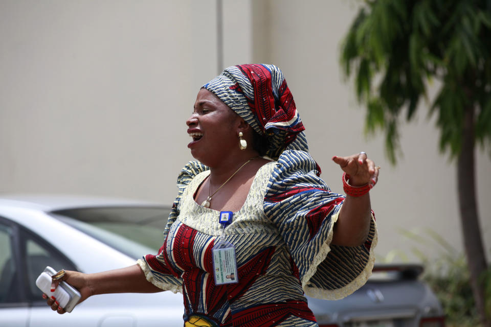 A woman react at Asokoro hospital morgue after she lost a relative following an explosion at a bus park in Abuja, Nigeria, Tuesday, April. 15, 2014, with at least 72 feared dead as the blast destroyed more than 30 vehicles and caused secondary explosions as their fuel tanks exploded and burned. The Monday attack just miles from Nigeria's seat of government increases doubts about the military's ability to contain an Islamic uprising that is dividing the country on religious lines as never before. (AP Photo/ Sunday Alamba)