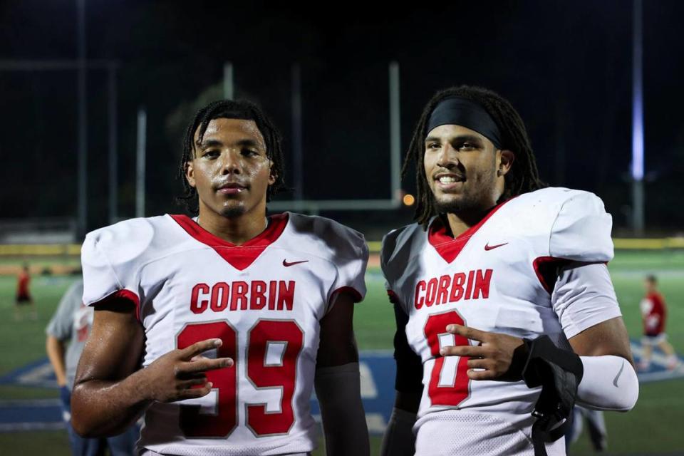 Corbin’s Jerod Smith (99) and Jacob Smith (0) pose for a photo after a game against Lexington Catholic on Sept. 1.